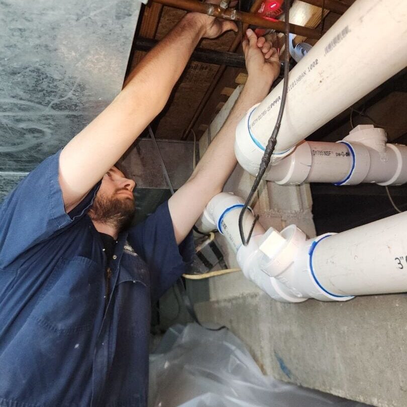 14 Crawl Space Water Lines Drain Lines Leaking Pipes Leaks Repipe All-Pro Plumbing Kokomo IN Plumber from All-Pro Plumbing working on water lines in a Kokomo, IN crawl space.