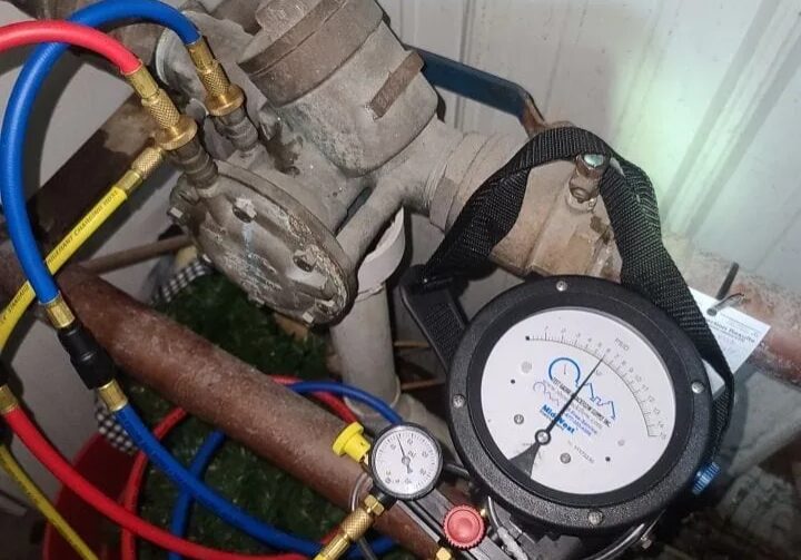 22-1 Commercial Irrigation INAWC CCN Regulator Backflow Testing Zurn Wilkins Apollo Watts Plumber performing backflow prevention device testing on a commercial irrigation system with gauges and hoses by All-Pro Plumbing in Kokomo, IN