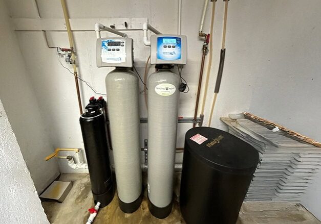 4-1e Water Treatment One Filter Impressions Plus Sanitizer Water Softener_ Installed water treatment system with water heater, brine tank, and filters by All-Pro Plumbing in Kokomo, IN