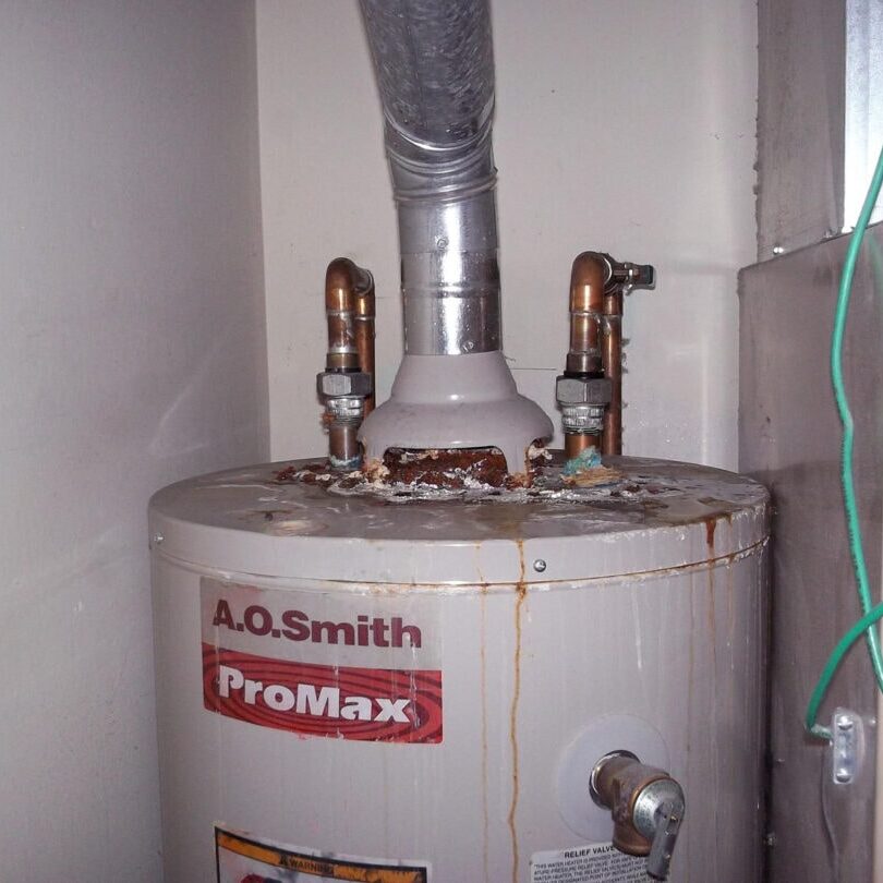 44 Leaking Water Heater WH Vent Corrosion Tank Failure Dielectric Union All-Pro Plumbing Kokomo IN Severe water heater corrosion from failed dielectric union All-Pro Plumbing Kokomo Indiana